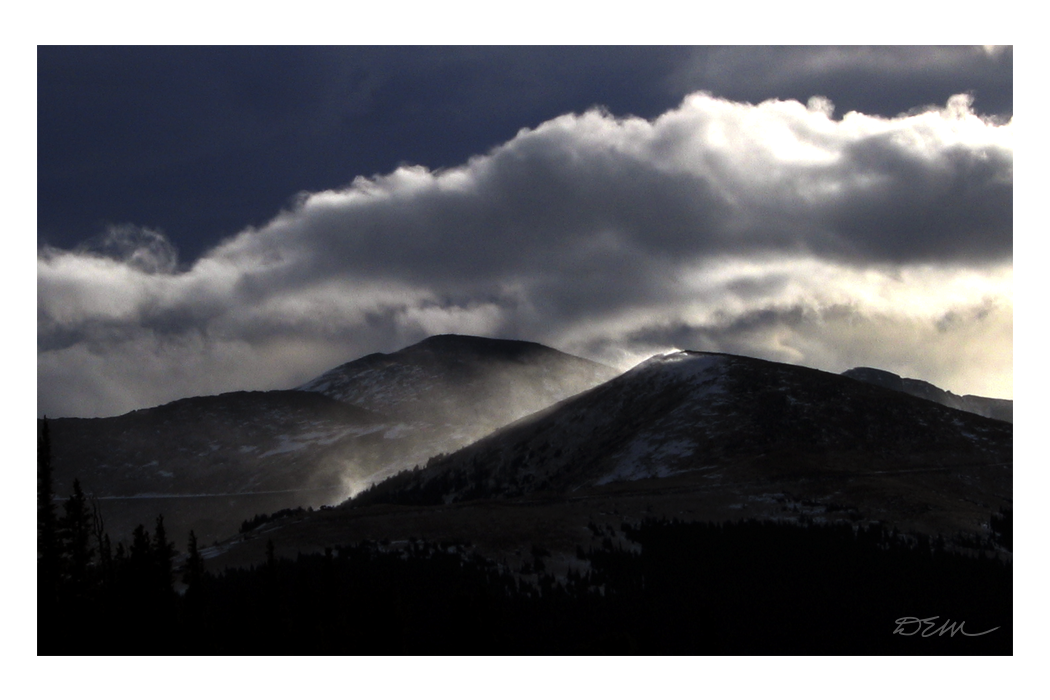 Sunlit Clouds in Rocky Mountain peaks